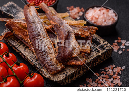 Dried salted fish as snacks or jerky, seafood as slices. Dried seafood snacks Dried salted fish as snacks or jerky, seafood as slices. Dried seafood snacks 131221720