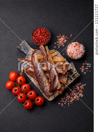 Dried salted fish as snacks or jerky, seafood as slices. Dried seafood snacks Dried salted fish as snacks or jerky, seafood as slices. Dried seafood snacks 131221727