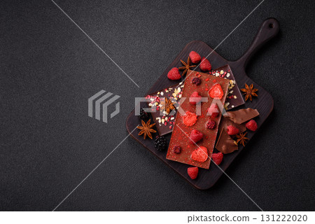 Bar sweet craft artisan chocolate with dried fruits made at home. Craft chocolate Bar sweet craft artisan chocolate with dried fruits made at home. Craft chocolate 131222020