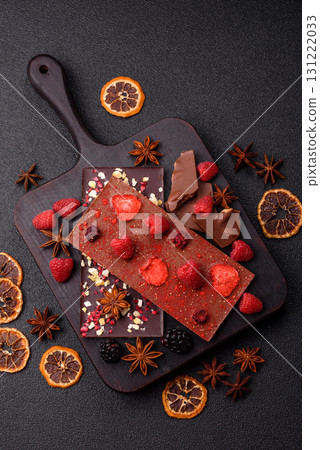 Bar sweet craft artisan chocolate with dried fruits made at home. Craft chocolate Bar sweet craft artisan chocolate with dried fruits made at home. Craft chocolate 131222033