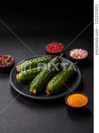 Fresh raw whole cucumbers, an ingredient for preparing salads and vegetarian dishes. Green fresh cucumbers 131222055