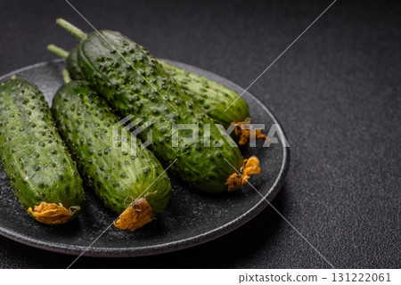 Fresh raw whole cucumbers, an ingredient for preparing salads and vegetarian dishes. Green fresh cucumbers Fresh raw whole cucumbers, an ingredient for preparing salads and vegetarian dishes. Green fresh cucumbers 131222061