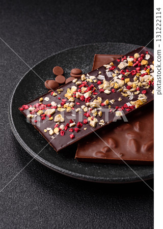 Bar sweet craft artisan chocolate with dried fruits made at home. Craft chocolate Bar sweet craft artisan chocolate with dried fruits made at home. Craft chocolate 131222114