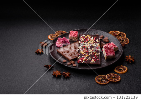Bar sweet craft artisan chocolate with dried fruits made at home. Craft chocolate Bar sweet craft artisan chocolate with dried fruits made at home. Craft chocolate 131222139