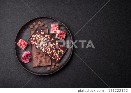 Bar sweet craft artisan chocolate with dried fruits made at home. Craft chocolate Bar sweet craft artisan chocolate with dried fruits made at home. Craft chocolate 131222152