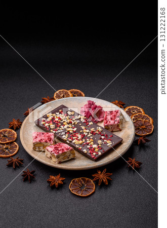 Bar sweet craft artisan chocolate with dried fruits made at home. Craft chocolate Bar sweet craft artisan chocolate with dried fruits made at home. Craft chocolate 131222168