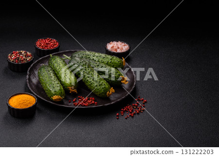 Fresh raw whole cucumbers, an ingredient for preparing salads and vegetarian dishes. Green fresh cucumbers Fresh raw whole cucumbers, an ingredient for preparing salads and vegetarian dishes. Green fresh cucumbers 131222203