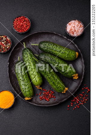 Fresh raw whole cucumbers, an ingredient for preparing salads and vegetarian dishes. Green fresh cucumbers 131222205