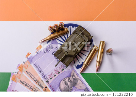 Money and flag of India with ammunition and tank as a concept of weapons for war. India and weapons 131222210