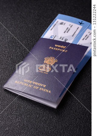 Indian passport and tickets for travelling, flying and doing business. India document, id 131222244