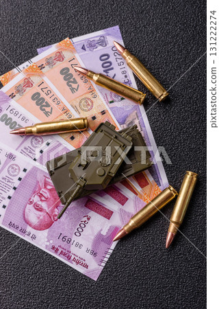 Money and flag of India with ammunition and tank as a concept of weapons for war. India and weapons 131222274