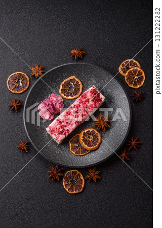 Nougat or white caramel with hazelnuts and strawberry pieces. White nougat 131222282