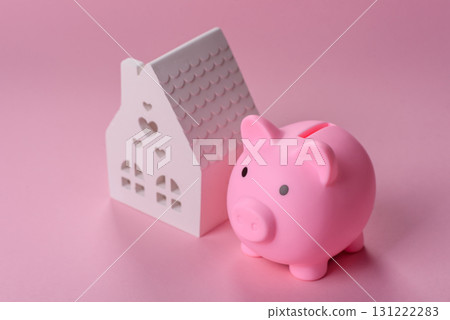 House, buying or selling real estate, concept background with money and piggy bank. Real estate 131222283