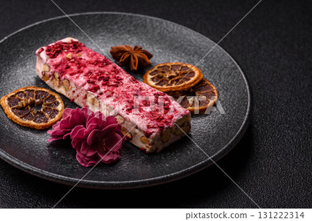 Nougat or white caramel with hazelnuts and strawberry pieces. White nougat Nougat or white caramel with hazelnuts and strawberry pieces. White nougat 131222314