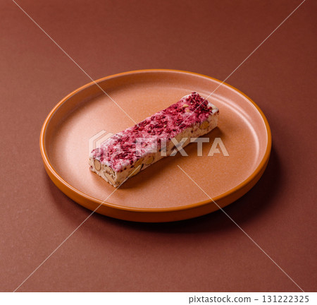 Nougat or white caramel with hazelnuts and strawberry pieces. White nougat 131222325