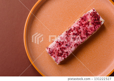 Nougat or white caramel with hazelnuts and strawberry pieces. White nougat Nougat or white caramel with hazelnuts and strawberry pieces. White nougat 131222327