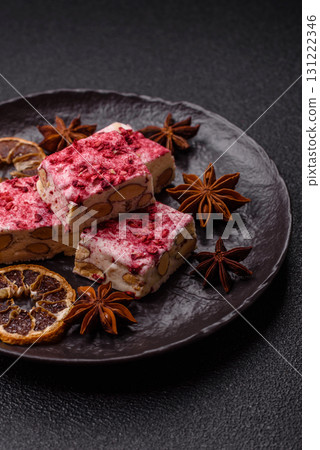 Nougat or white caramel with hazelnuts and strawberry pieces. White nougat Nougat or white caramel with hazelnuts and strawberry pieces. White nougat 131222346