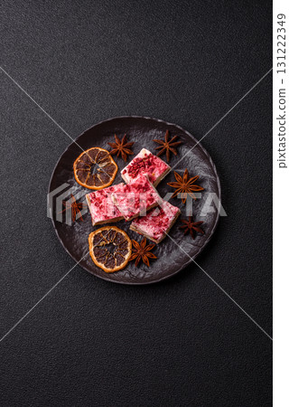 Nougat or white caramel with hazelnuts and strawberry pieces. White nougat Nougat or white caramel with hazelnuts and strawberry pieces. White nougat 131222349