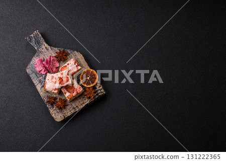 Nougat or white caramel with hazelnuts and strawberry pieces. White nougat Nougat or white caramel with hazelnuts and strawberry pieces. White nougat 131222365