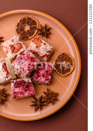 Nougat or white caramel with hazelnuts and strawberry pieces. White nougat Nougat or white caramel with hazelnuts and strawberry pieces. White nougat 131222380