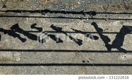 Abstract decorative fence shadow pattern on concrete ground 131222616