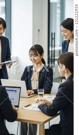 A Japanese business team engaged in lively discussions 131222919