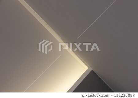 Soft light highlights a clean corner in a quiet, modern space 131223097