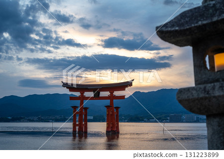 Torii of Itsukushima Shrine at sunset on Miyajima island Torii of Itsukushima Shrine at sunset on Miyajima island 131223899