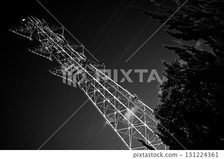 Monochrome image of a power transmission tower 131224361