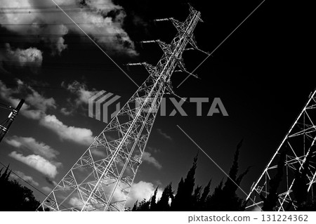 Monochrome image of a power transmission tower 131224362