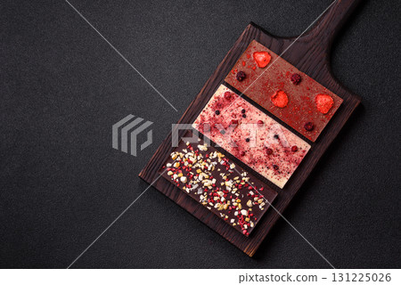 Bar sweet craft artisan chocolate with dried fruits made at home. Craft chocolate Bar sweet craft artisan chocolate with dried fruits made at home. Craft chocolate 131225026