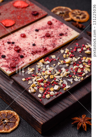 Bar sweet craft artisan chocolate with dried fruits made at home. Craft chocolate 131225036