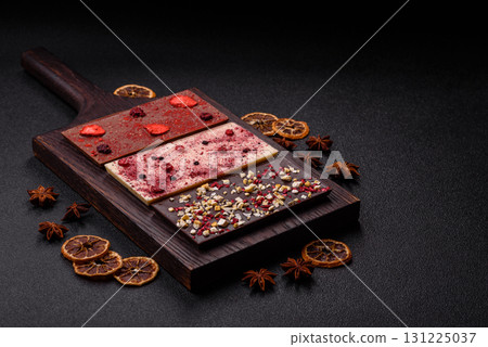 Bar sweet craft artisan chocolate with dried fruits made at home. Craft chocolate Bar sweet craft artisan chocolate with dried fruits made at home. Craft chocolate 131225037