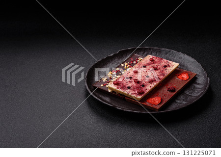 Bar sweet craft artisan chocolate with dried fruits made at home. Craft chocolate Bar sweet craft artisan chocolate with dried fruits made at home. Craft chocolate 131225071