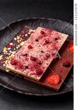 Bar sweet craft artisan chocolate with dried fruits made at home. Craft chocolate 131225076