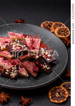 Bar sweet craft artisan chocolate with dried fruits made at home. Craft chocolate 131225095