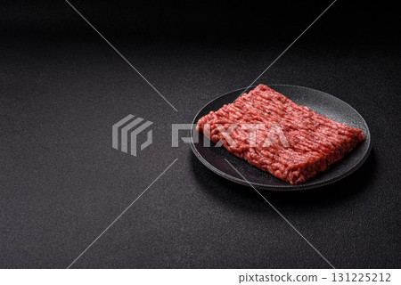 Raw ground beef meat food, ingredient for making cutlets or meatballs. Raw ground beef 131225212