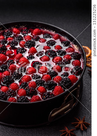 Pie, cheesecake with raspberries and blackberries, mascarpone cheese. Piece of cheesecake 131225256