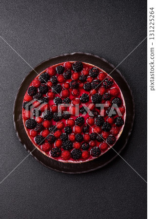 Pie, cheesecake with raspberries and blackberries, mascarpone cheese. Piece of cheesecake 131225264