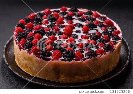 Pie, cheesecake with raspberries and blackberries, mascarpone cheese. Piece of cheesecake 131225266