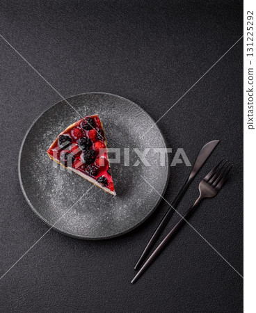 Pie, cheesecake with raspberries and blackberries, mascarpone cheese. Piece of cheesecake 131225292