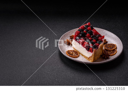 Pie, cheesecake with raspberries and blackberries, mascarpone cheese. Piece of cheesecake 131225310