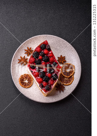 Pie, cheesecake with raspberries and blackberries, mascarpone cheese. Piece of cheesecake 131225315