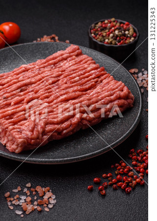 Raw ground beef meat food, ingredient for making cutlets or meatballs. Raw ground beef Raw ground beef meat food, ingredient for making cutlets or meatballs. Raw ground beef 131225343