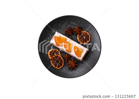 Nougat or white caramel with hazelnuts and pistachios and citrus pieces. White nougat with nuts Nougat or white caramel with hazelnuts and pistachios and citrus pieces. White nougat with nuts 131225607