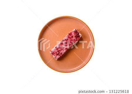 Nougat or white caramel with hazelnuts and strawberry pieces. White nougat Nougat or white caramel with hazelnuts and strawberry pieces. White nougat 131225618