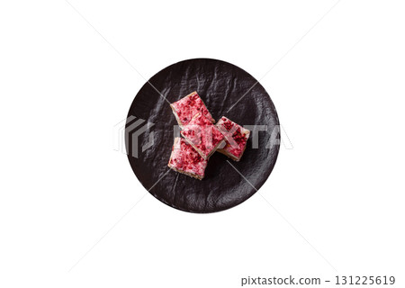 Nougat or white caramel with hazelnuts and strawberry pieces. White nougat Nougat or white caramel with hazelnuts and strawberry pieces. White nougat 131225619