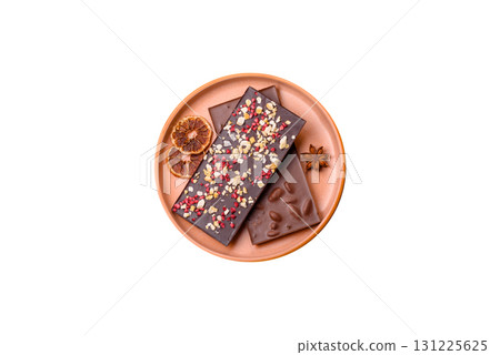 Bar sweet craft artisan chocolate with dried fruits made at home. Craft chocolate 131225625