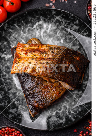 Food, seafood, grilled fish fillet with lemon, salt and spices. Grilled fish fillet 131225669