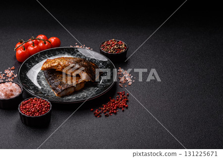 Food, seafood, grilled fish fillet with lemon, salt and spices. Grilled fish fillet Food, seafood, grilled fish fillet with lemon, salt and spices. Grilled fish fillet 131225671